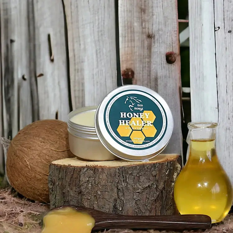 Eco Horse Honey Healer cream on wooden surface with honey and natural elements for soothing minor wounds.