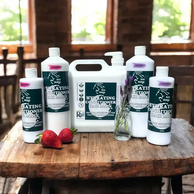 Eco Horse Hydrating Conditioner Mask bottles on a rustic wooden table with strawberries, highlighting natural horse care.