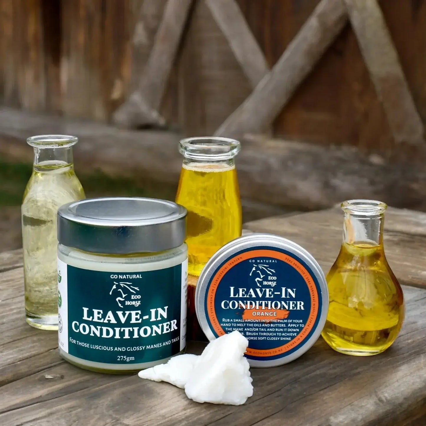 Eco Horse Leave-In Conditioner in jars and bottles surrounded by natural oils, perfect for luscious manes and tails.