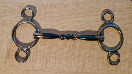 Trust Pony Universal used bit, 115mm size, in good condition on wooden background.